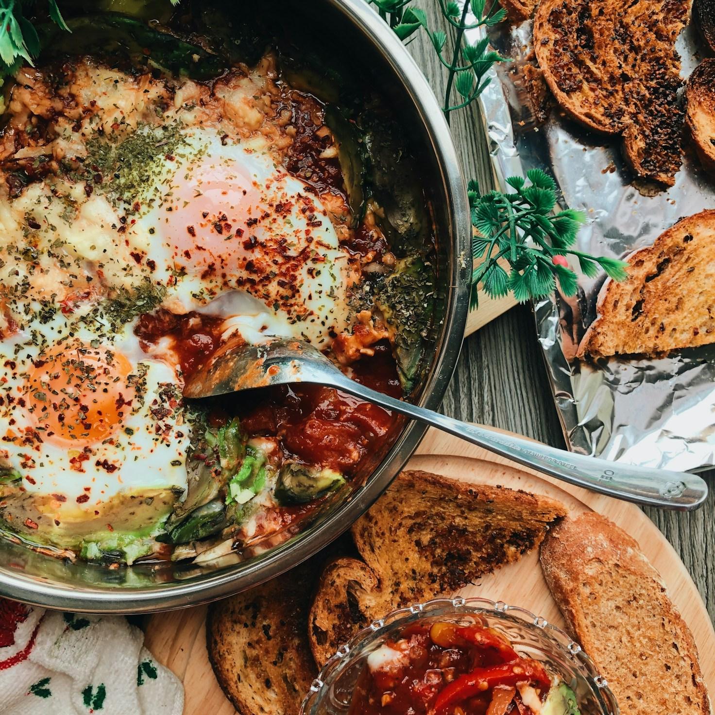 Community members collaborating in a modern kitchen space, sharing recipes and cooking techniques